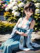 A woman in a blue dress sitting on a bench.